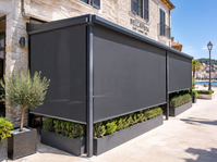Dark vertical awnings enclosing a terrace with planters
