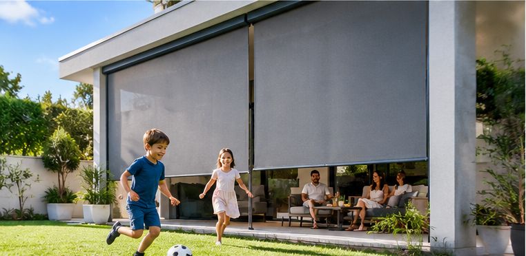 Vertical awnings lowered around a covered veranda while children play in the garden